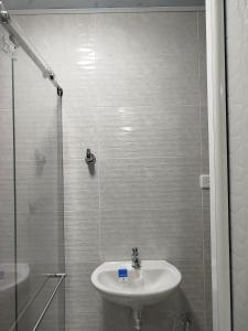 a bathroom with a sink and a shower at Santa Marta 1 in Yopal +12 photos