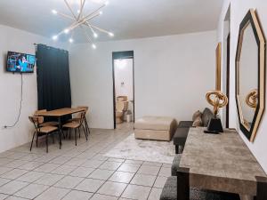 a living room with a couch and a table at Villa seda in Rincon