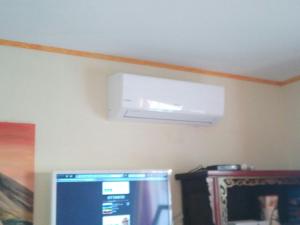 a white air conditioner hanging from a ceiling at Penthouse El Mirador Los Cristianos Tenerife - VV in Los Cristianos