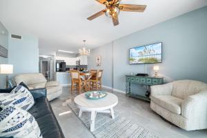 a living room with a couch and a table at Caribbean Unit 103 in Gulf Shores +36 photos
