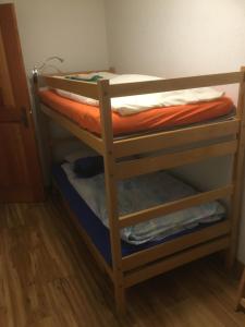 a couple of bunk beds in a room at Wohnung 17, Marico in Zermatt