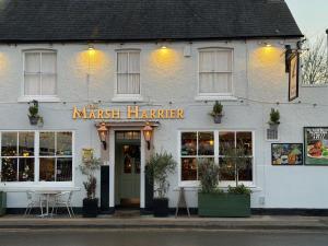 a white building with a market harrier sign on it at The Marsh Harrier B&B in Oxford