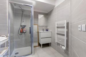 a bathroom with a shower and a sink at L'Escapade Paris in Le Kremlin-Bicêtre +165 photos