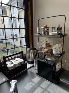 a kitchen with a counter top with some food on it at Boutique Apartment Perenne in Maastricht