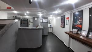 a room with a bar with a counter in a room at Center Plaza Hotel in São Paulo