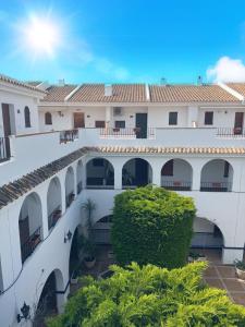a view of the courtyard of a building at Club aldeas de taray in San Javier