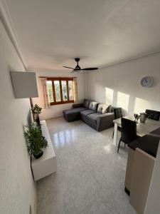 a living room with a couch and a table at Club aldeas de taray in San Javier