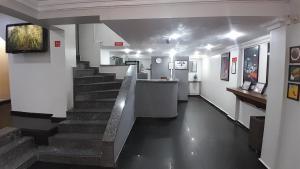 a hallway with a staircase in a building at Center Plaza Hotel in São Paulo