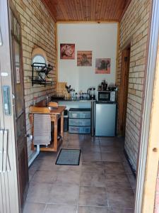 a kitchen with a sink and a counter top at IVCA Cottage in Addo