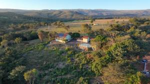 an aerial view of a house on a hill at Quintal de minas Pousada in Delfinópolis