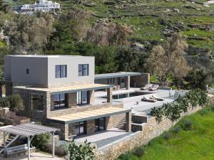 an aerial view of a house on a hill at Villa Apollo in Kionia