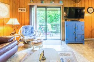 a living room with a couch and a blue cabinet at 7602 - Drydock in Avon