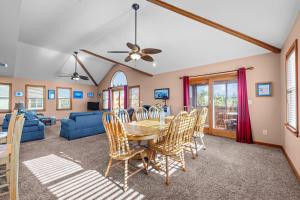 a dining room and living room with a table and chairs at 7834 - Royal - T in Frisco