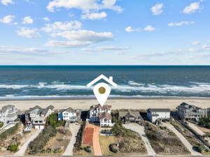 an aerial view of a beach with a kite on it at 2876 - The Blue Martini in Duck