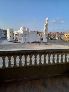 a view of a building from a balcony at El Basha Apartment sea View in Dumyāţ al Jadīdah