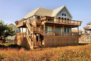 a large house with decks on a hill at 2408 - Herring Gull in Duck