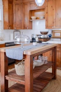a kitchen with a wooden table with a counter top at The Old Crowe Inn Bed and Breakfast in Fruita