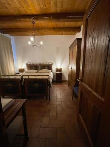 a bedroom with two beds and a wooden ceiling at Residenza Airone in Vicenza