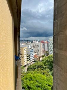 a view of a city from a window of a building at Apto no Centro de Porto Alegre in Porto Alegre