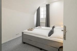 a bedroom with a bed and a window at Beethoven Suite in Vienna