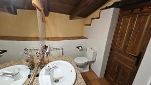 a bathroom with a sink and a toilet at La Clerecia de Ledesma in Ledesma +61 photos