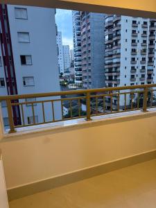 a balcony with a view of the city at Maison Perdizes 506 - Até 6 pessoas - Allianz Parque in São Paulo