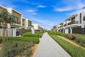 a walkway in front of some apartment buildings at Warm and Cozy 4BR Villa with Pool Access in Dubai