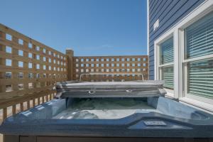 a hot tub on the balcony of a building at 7677 - Weathering Heights in Avon