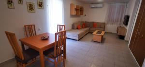 a living room with a couch and a table at HauSol Vendégház in Gárdony