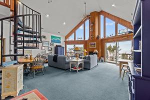 a living room filled with furniture and a staircase at 7828 - Swing Belly's Roost in Frisco