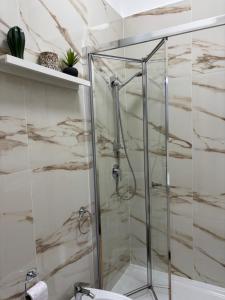 a shower with a glass door in a bathroom at Dolce Vita in Bari +46 photos