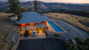an aerial view of a house with a swimming pool at Alpine Luxury Chelan Vacation Rentals in Chelan