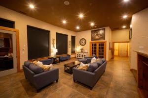 a large living room with couches and a tv at Alpine Luxury Chelan Vacation Rentals in Chelan