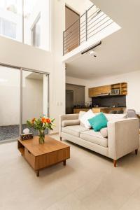 a living room with a couch and a coffee table at Quiet and comfortable space in Aguascalientes