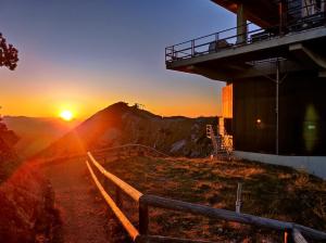 a sunset on the top of a mountain at WildAlps-Apartments in Wildalpen