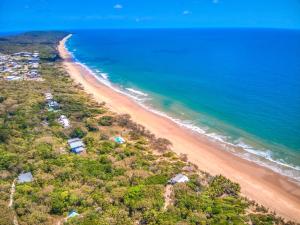 an aerial view of a beach and the ocean at Solis in Agnes Water in Agnes Water