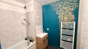 a bathroom with a shower and a sink at Le Terrier in Noisiel +26 photos