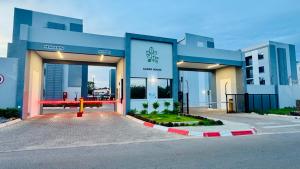a building with a fire hydrant in front of it at Orchid Belvedere Suites 102 - The Fig in Gaborone