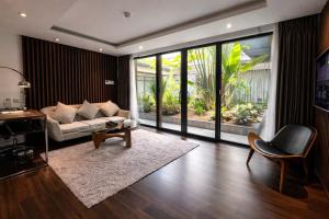 a living room with a couch and a table at KP Hotel in Can Tho