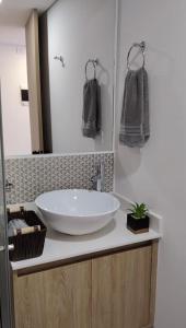 a bathroom with a large white sink on a counter at Estocolmo in Armenia +10 photos