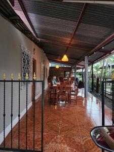 a dining room with a table and chairs at Hostal Bullshark in Cuatro Esquinas