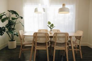 a dining room with a table and chairs at Soleil House in Fort Saint John