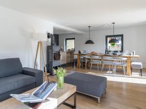a living room with a couch and a table at Mozart Lodge in Wagrain