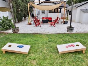 two platforms in the grass with bows on them at Charming Craftsman - Beach Close in Long Beach