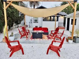 a group of red chairs and a fire pit at Charming Craftsman - Beach Close in Long Beach