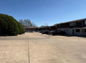 a parking lot in front of a building at Americas Best Value Inn Ponca City in Ponca City