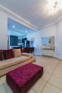 a living room with a couch and a table at VIP Home in El Aouina Station
