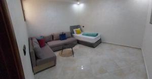 a living room with a couch and a sink at rooms maissa 1 in Cabo Bojador