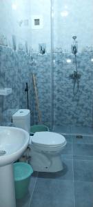 a bathroom with a toilet and a sink and a shower at rooms maissa 1 in Cabo Bojador