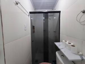 a bathroom with a shower and rolls of toilet paper at Studio luxo Periperi in Salvador +20 photos